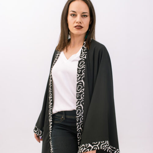 Black is beautiful and timelessly classic! Which is why the Black Tribal Kimono is one of our biggest sellers! It’s a wardrobe essential that can be paired with almost anything and everything. Sizes: Short, Medium, Tall Fabrics: Chiffon & Printed Mini Matt Washing Instructions: Hand or machine wash on a low temperature (30 degrees) Iron on a medium heat