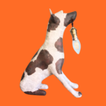Image of a lamp sculpted in the shape of a dog from upcycled materials, including dictionary pages.